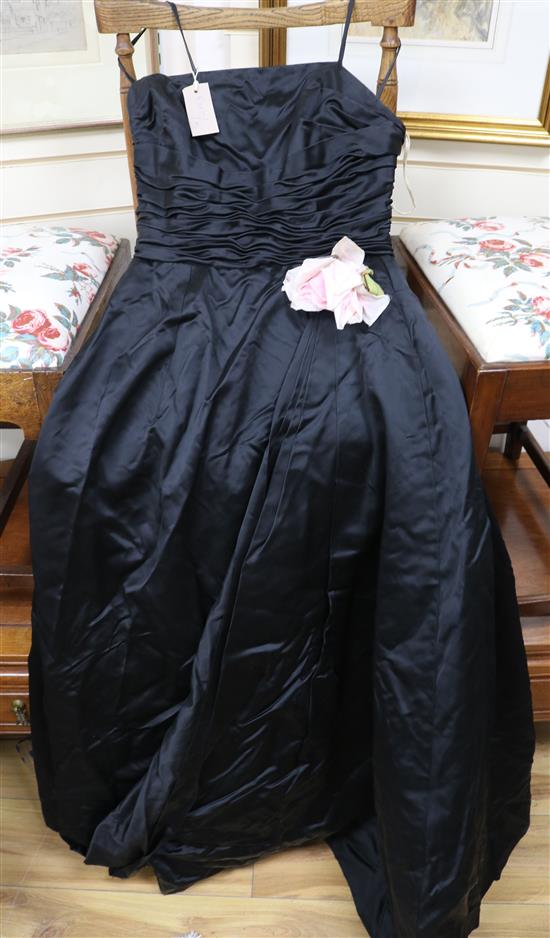 A 1950s black satin evening dress